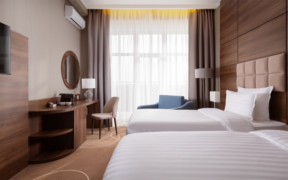 Deluxe + Room with a balcony and 2 single Beds