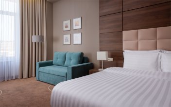 Junior Room with a large double bed and sofa: Photo 2