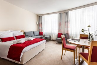 Family Room with a double bed and a sofa: Photo 1